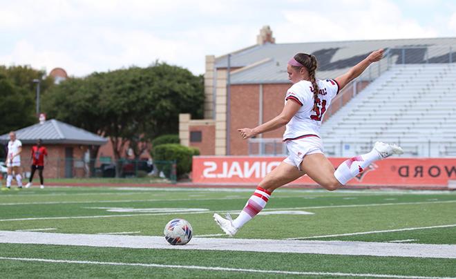 Student playing soccer